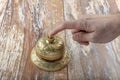 Man ringing in service bell on reception table, closeup Royalty Free Stock Photo