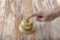 Man ringing in service bell on reception table, closeup Royalty Free Stock Photo