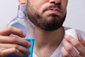 Man Rinsing His Mouth With Mouthwash Royalty Free Stock Photo