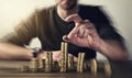 Man rising coins on stacks Royalty Free Stock Photo