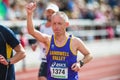 Man rising his hand on the final stretch at Stockholm Stadion