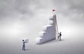 Man rising stairs to reach the top of the tower. Competition for success. Choosing the right path to success. Business concept