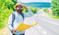 Man at road side with map. Expeditor backpacker map look orienteering direction. Orienteering topographic map. Expeditor Royalty Free Stock Photo