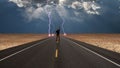 Man on road before storm Royalty Free Stock Photo