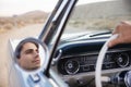 Man On Road Trip Driving Classic Convertible Car Reflected In Wing Mirror Royalty Free Stock Photo