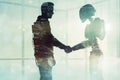 Man and robot shaking hands, concept of technological innovation, cooperation between robots and future artificial