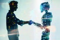 Man and robot shaking hands, concept of technological innovation, cooperation between robots and future artificial