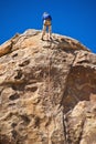 Man rock climbing, Joshua Tree National Park Royalty Free Stock Photo