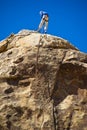 Man rock climbing, Joshua Tree National Park Royalty Free Stock Photo