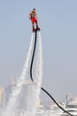 Man rocketing from the water on a flyboard