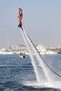 Man rocketing from the water on a flyboard