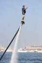 Man rocketing from the water on a flyboard