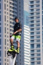 Man rocketing from the water on a flyboard