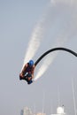 Man rocketing from the water on a flyboard