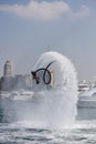 Man rocketing from the water on a flyboard