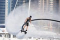 Man rocketing from the water on a flyboard