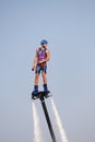 Man rocketing from the water on a flyboard