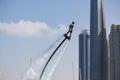 Man rocketing from the water on a flyboard