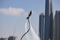 Man rocketing from the water on a flyboard