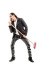 Man Rocking Out with broom