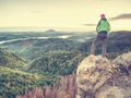 Man in rocks. Climbing hiking silhouette in fall mountains