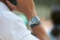 Man with Rolex Submariner watch and black bracelet tattoo before Emporio Armani fashion show, Milan Fashion Week Royalty Free Stock Photo