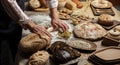 Man rolling out dough on kitchen table, close up Royalty Free Stock Photo