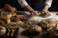 Man rolling out dough on kitchen table, close up Royalty Free Stock Photo