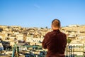 Man on the rooftop enjoying view of Fez old arabic medina, Morocco, Africa Royalty Free Stock Photo