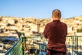 Man on the rooftop enjoying view of Fez old arabic medina, Morocco, Africa Royalty Free Stock Photo