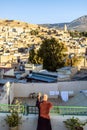 Man on the rooftop enjoying view of Fez old arabic medina, Morocco, Africa Royalty Free Stock Photo