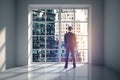 Man in room looking at city Royalty Free Stock Photo