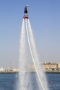 The man rose to the maximum height in the competition for the fly boarding at SkyDiveDubai Royalty Free Stock Photo