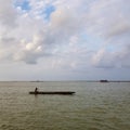 Man rowing boat on lake Royalty Free Stock Photo