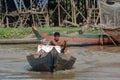 Man Rowing Boat Through Tonle Sap Lake Fishing Village Cambodia Royalty Free Stock Photo