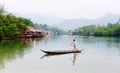 A man rowing boat at the village in Koh Chang, Thailand Royalty Free Stock Photo