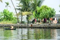 Man rowing a canoe on the backwaters of Alleppey Royalty Free Stock Photo