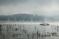 A man rowing his boat in Sangkhlaburi, thailand