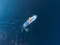 Man rowing oar on sup board blue sea water. Aerial top view paddleboard Royalty Free Stock Photo