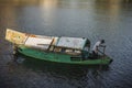 Man rowing a traditional river boat transporting people across Sarawak River