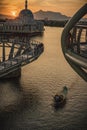 Man rowing a traditional river boat transporting people across Sarawak River