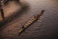 Man rowing a traditional river boat transporting people across Sarawak River