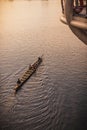 Man rowing a traditional river boat transporting people across Sarawak River