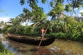 A man rows a traditional boat