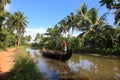 A man rows a traditional boat