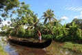 A man rows a traditional boat