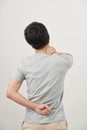 Man rubbing his painful back close up. Business man holding his Royalty Free Stock Photo