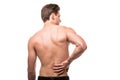 Man rubbing his painful back. Pain relief, chiropractic concept Royalty Free Stock Photo