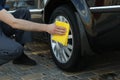 A man rubs a car. Car wash. Clear car