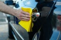 A man rubs a car Car wash. Clear car concept